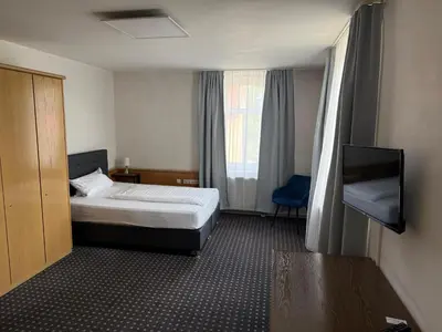 Ein Bett oder Betten in einem Zimmer der Unterkunft Hotel in