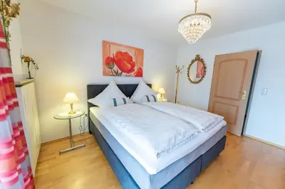 Ein Bett oder Betten in einem Zimmer der Unterkunft Ferienwohnung Haus Siebenstern