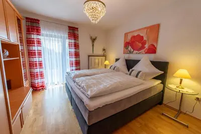 Ein Bett oder Betten in einem Zimmer der Unterkunft Ferienwohnung Haus Siebenstern