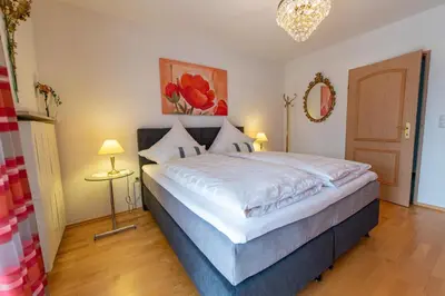 Ein Bett oder Betten in einem Zimmer der Unterkunft Ferienwohnung Haus Siebenstern