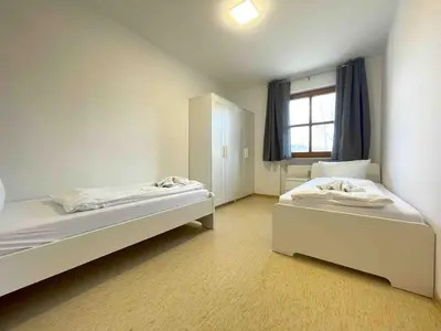 Ein Bett oder Betten in einem Zimmer der Unterkunft STA1043 gut geschnittene Monteurwohnung mit Balkon