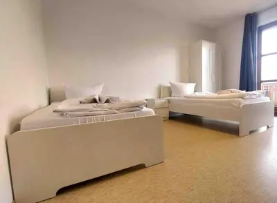 Ein Bett oder Betten in einem Zimmer der Unterkunft STA1043 gut geschnittene Monteurwohnung mit Balkon