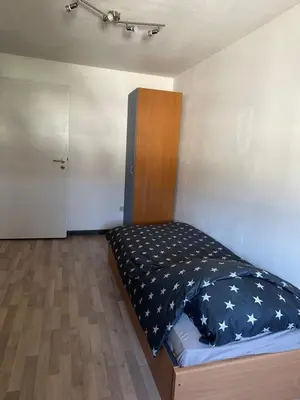 Ein Bett oder Betten in einem Zimmer der Unterkunft 2 Raum Ferienwohnung mit 2 Schlafzimmer
