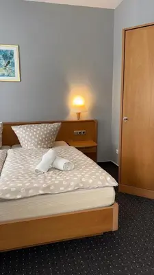 Ein Bett oder Betten in einem Zimmer der Unterkunft Sparta Hotel