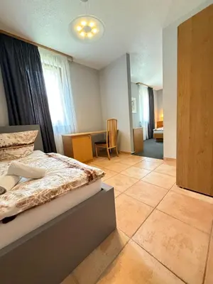 Ein Bett oder Betten in einem Zimmer der Unterkunft Sparta Hotel