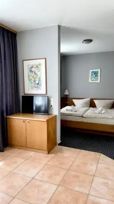 Ein Bett oder Betten in einem Zimmer der Unterkunft Sparta Hotel