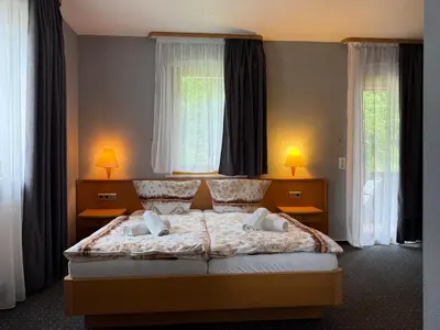 Ein Bett oder Betten in einem Zimmer der Unterkunft Sparta Hotel