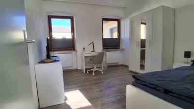Ein Bett oder Betten in einem Zimmer der Unterkunft Ferienwohnung am Perlenbach