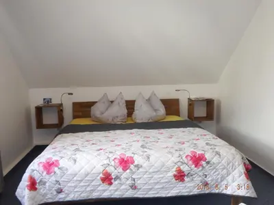Ein Bett oder Betten in einem Zimmer der Unterkunft Ferienvermietung Engelstädter