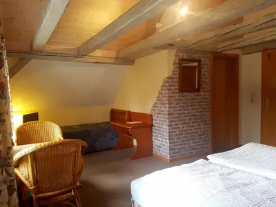Ein Bett oder Betten in einem Zimmer der Unterkunft Cafe und Pension am Rennsteig