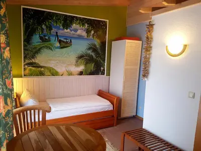 Ein Bett oder Betten in einem Zimmer der Unterkunft Cafe und Pension am Rennsteig
