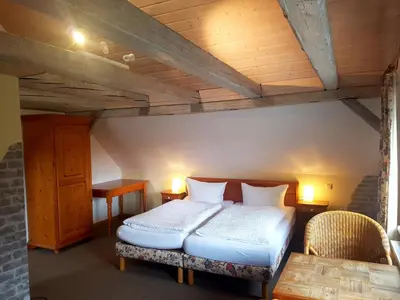 Ein Bett oder Betten in einem Zimmer der Unterkunft Cafe und Pension am Rennsteig