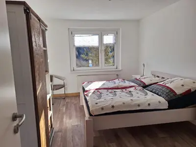 Ein Bett oder Betten in einem Zimmer der Unterkunft Gipfelblick
