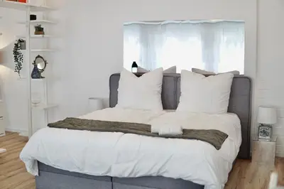 Ein Bett oder Betten in einem Zimmer der Unterkunft Garden Luxus Apartment