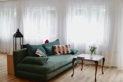 Ein Sitzbereich in der Unterkunft Garden Luxus Apartment