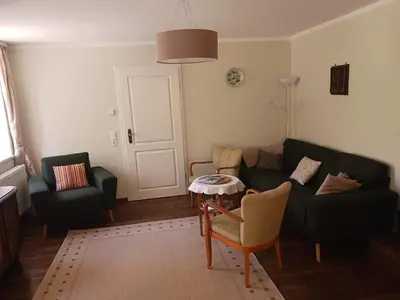 Ein Sitzbereich in der Unterkunft Holiday Apartment with Garden View