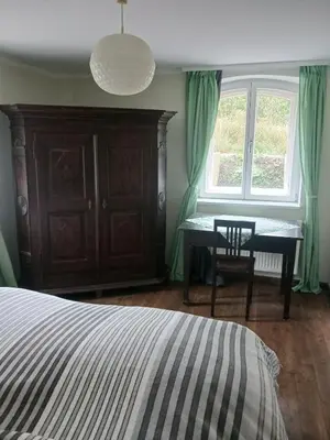 Ein Bett oder Betten in einem Zimmer der Unterkunft Holiday Apartment with Garden View