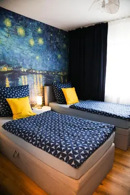 Ein Bett oder Betten in einem Zimmer der Unterkunft Suite 13 Van Gogh
