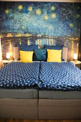 Ein Bett oder Betten in einem Zimmer der Unterkunft Suite 13 Van Gogh
