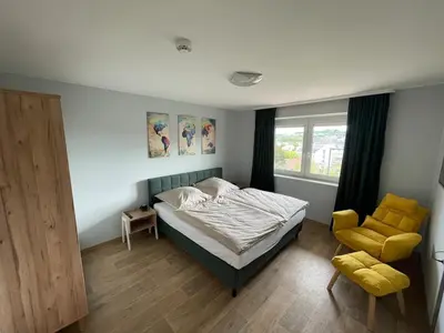 Ein Bett oder Betten in einem Zimmer der Unterkunft Ferienwohnung Stadthaus Cham