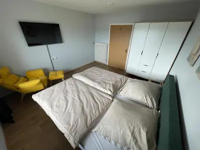 Ein Bett oder Betten in einem Zimmer der Unterkunft Ferienwohnung Stadthaus Cham