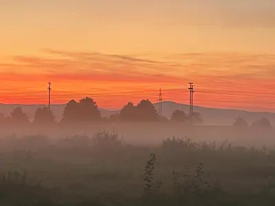 Blick auf den Sonnenuntergang/Sonnenaufgang von der Ferienwohnung aus oder aus der Nähe