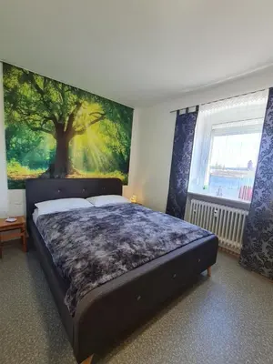 Ein Bett oder Betten in einem Zimmer der Unterkunft Ferienwohnung für 1 bis 2 Personen