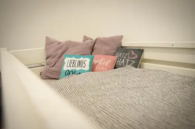 Ein Bett oder Betten in einem Zimmer der Unterkunft TheFamilyNest