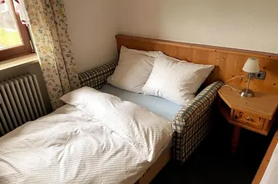 Ein Bett oder Betten in einem Zimmer der Unterkunft Geräumige Ferienwohnung inmitten der Natur