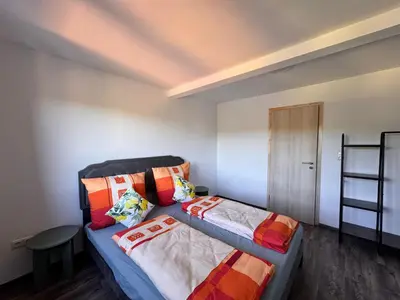 Ein Bett oder Betten in einem Zimmer der Unterkunft Ferienwohnung Hubertus