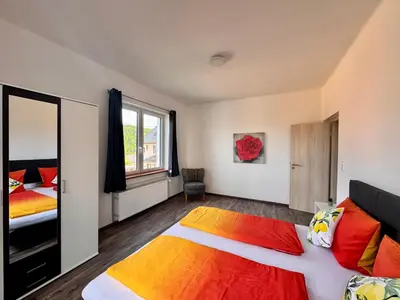 Ein Bett oder Betten in einem Zimmer der Unterkunft Ferienwohnung Hubertus