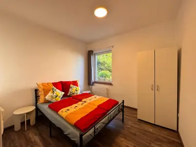 Ein Bett oder Betten in einem Zimmer der Unterkunft Ferienwohnung Hubertus