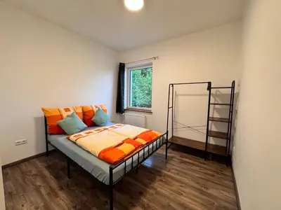 Ein Bett oder Betten in einem Zimmer der Unterkunft Ferienwohnung Hubertus