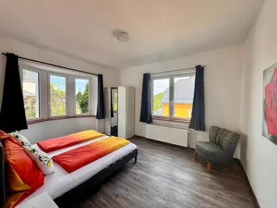 Ein Bett oder Betten in einem Zimmer der Unterkunft Ferienwohnung Hubertus