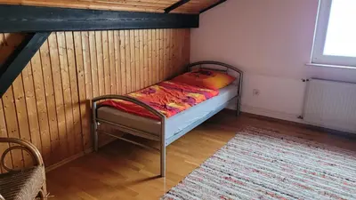 Ein Bett oder Betten in einem Zimmer der Unterkunft Ferienwohnung Jochen Riederer