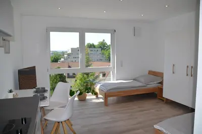 Ein Bett oder Betten in einem Zimmer der Unterkunft Apartment mit Küche, 2 Einzelbetten, Dusche, Parkplatz, schnellem Internet, ADA3