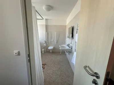 Ein Badezimmer in der Unterkunft GER-Haus