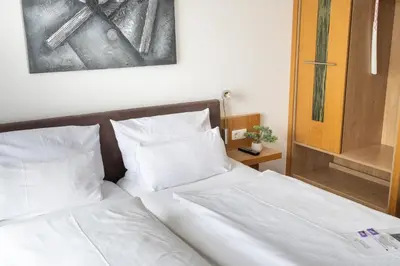 Ein Bett oder Betten in einem Zimmer der Unterkunft Stadthotel und Restaurant am See
