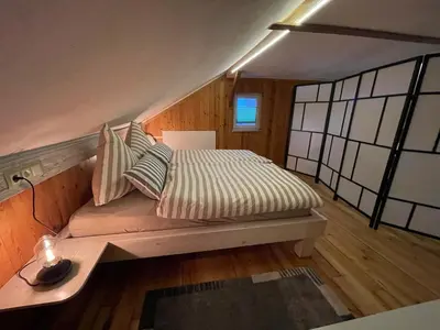 Ein Bett oder Betten in einem Zimmer der Unterkunft Spirkenhütte Fichtelberg - Ferienhaus bis 6 Personen - mit Sauna - am Fichtelsee