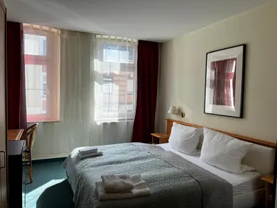 Ein Bett oder Betten in einem Zimmer der Unterkunft Hotel Ratskeller Falkenstein Vogtland