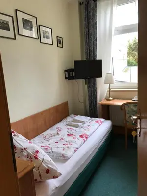 Ein Bett oder Betten in einem Zimmer der Unterkunft Hotel Ratskeller Falkenstein Vogtland
