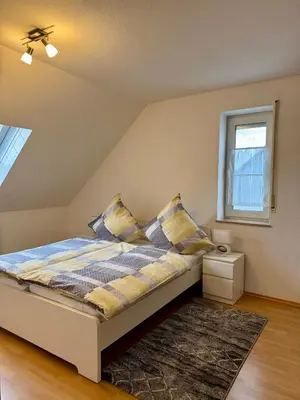 Ein Bett oder Betten in einem Zimmer der Unterkunft Bergjuwel mit Ruhe & Komfort - M20 - Frankenwald Apartments