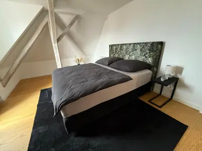 Ein Bett oder Betten in einem Zimmer der Unterkunft designAparts - I - Penthouse mit Dachterrasse