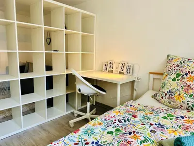Ein Bett oder Betten in einem Zimmer der Unterkunft Ferienwohnung Nähe Festspielhaus