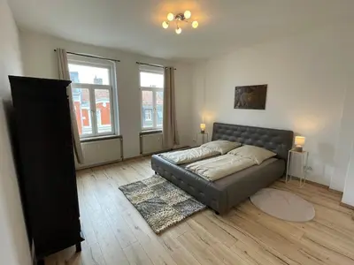 Ein Bett oder Betten in einem Zimmer der Unterkunft Schönes Apartment mit Infrarot Sauna und Balkon 