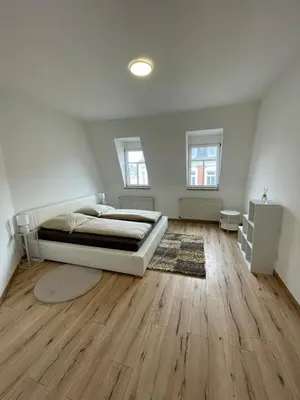 Ein Bett oder Betten in einem Zimmer der Unterkunft Schönes Apartment mit Infrarot Sauna und Balkon 