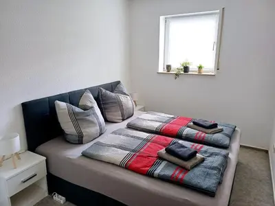 Ein Bett oder Betten in einem Zimmer der Unterkunft Ferienwohnung Familie Krauß