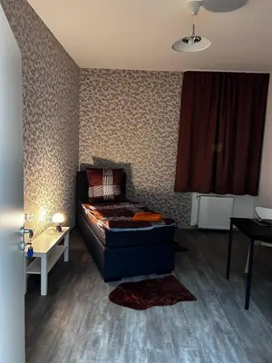 Ein Bett oder Betten in einem Zimmer der Unterkunft FeWo Vermietung Plauen