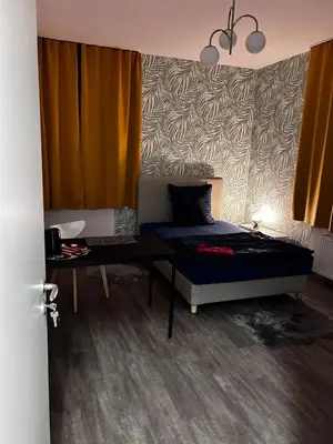 Ein Bett oder Betten in einem Zimmer der Unterkunft FeWo Vermietung Plauen
