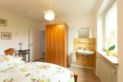 Ein Bett oder Betten in einem Zimmer der Unterkunft Ferienwohnung Spitzbergblick